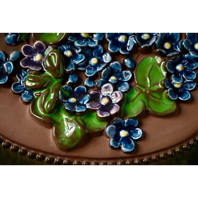 A soft, bohemian ceramic plaque, this typically Swedish wall decoration was produced by Jie Gantofta, a Scandinavian...