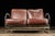 This brilliant example of late 1920s art deco and 1930s streamline design features a set of burgundy colored cushions with...