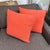 Design Plus Gallery presents a Pair of Woven Throw Pillows in Coral. These pillows feature a warm, vibrant pinkish-orange...