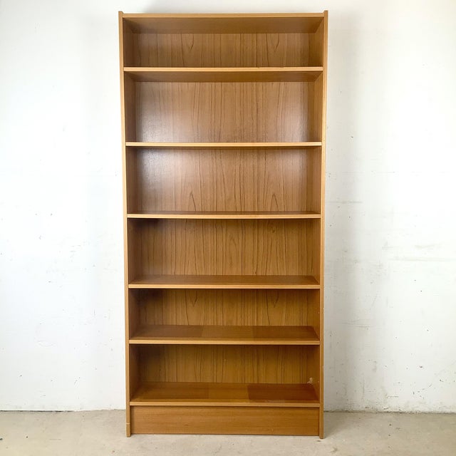 This Scandinavian Modern style teak bookcase exemplifies the clean lines, functional beauty, and timeless simplicity that...