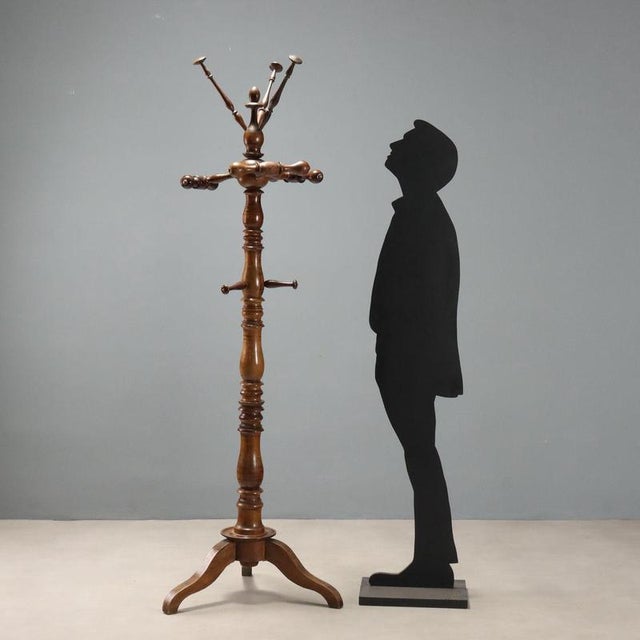 Walnut coat rack from the second half of the 19th century, originating from Italy, crafted with a sophisticated design...