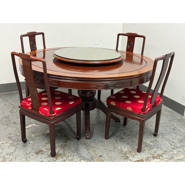 Design Plus Gallery presents a Rosewood Dining Table, Lazy Susan + Four Dining Room Chairs. The stunning round dining...