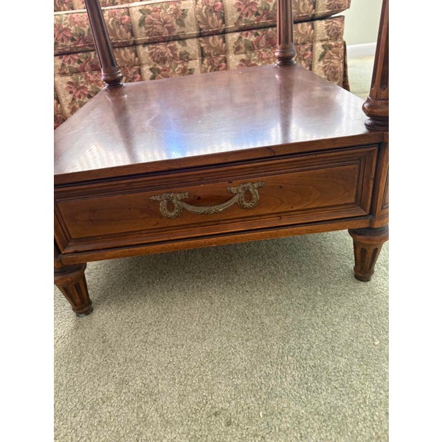 Vintage Henredon end tables with drawer in good used condition. Measures 22”H x 22”W x 26”D.