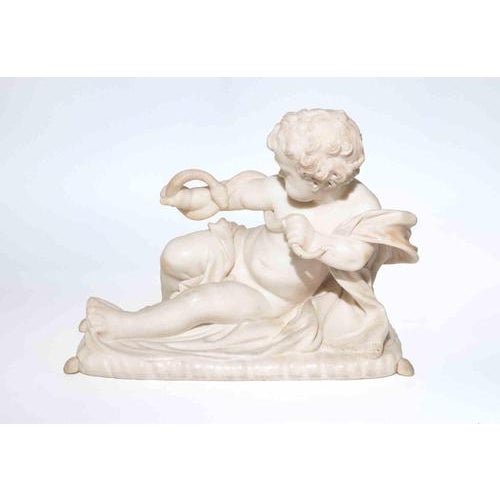 A finely carved marble sculpture depicting a reclining putto engaged in play with a serpent coiled around its arms,...