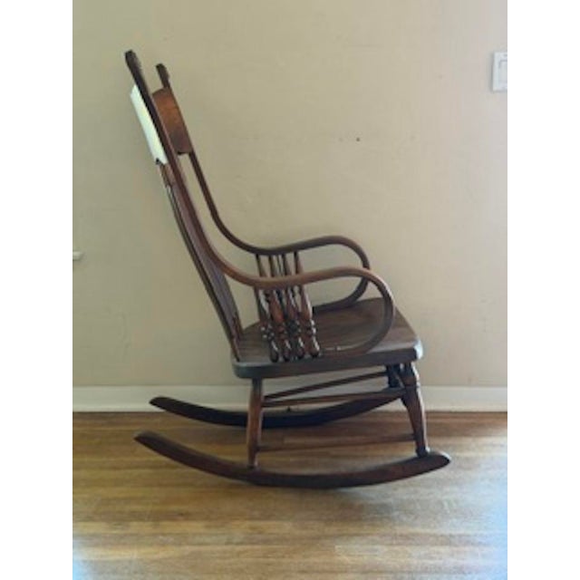 A very beautiful rocking chair with ornate design features. Hand crafted with attention to details. Was my Mother's who...