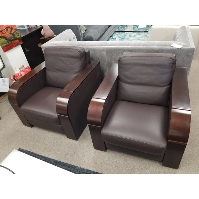 Welcome to these Duvivier chairs. Clean lines and luxurious leather.