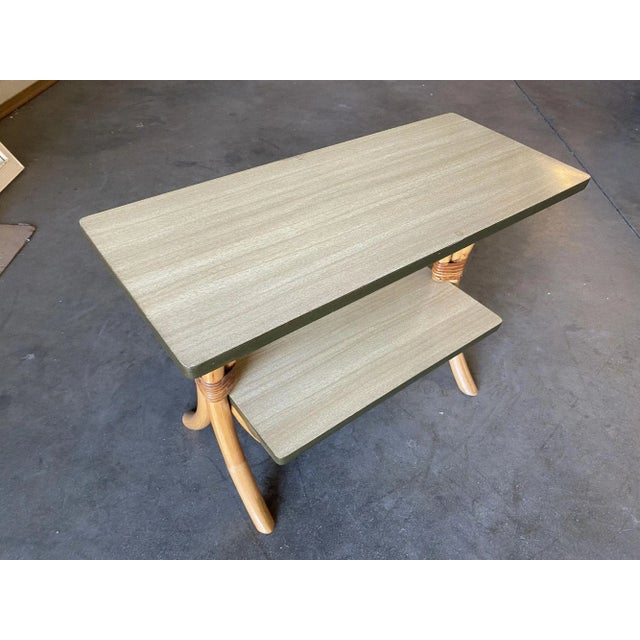 Swoop leg sofa or side table with a mahogany tabletop featuring a unique hourglass appearance with a two-tier design....