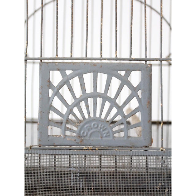 A Crown birdcage, circa 1920s–1940s, defined by clean lines and restrained geometry reflective of the Art Deco period. The...