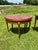 An elegant pair of 19th-century French Louis XVI demi-lune side tables, crafted in richly figured mahogany with beautiful...