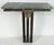 Offered for sale is a finely crafted Art Deco wall-mounted console table in brass, wrought iron, and marble. The console...