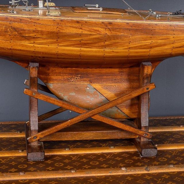 A fantastic vintage 20th Century sloop pond yacht, featuring original canvas sails. The yacht is an example of British...