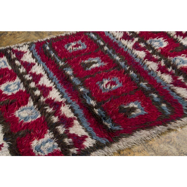 Hand-knotted in wool and originating circa 1950-1959, this 4x7 vintage Swedish rya rug joins Rug & Kilim’s Scandinavian...