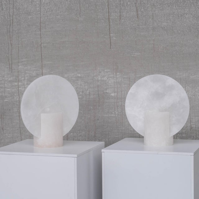 A pair of white tone alabaster table lamps. spain, 1990s. by repute new old stock with updated wiring. a simple design...