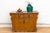 A rare and vibrant find from the late 19th century, this Ochre Merchant dresser is a substantial antique storage chest...
