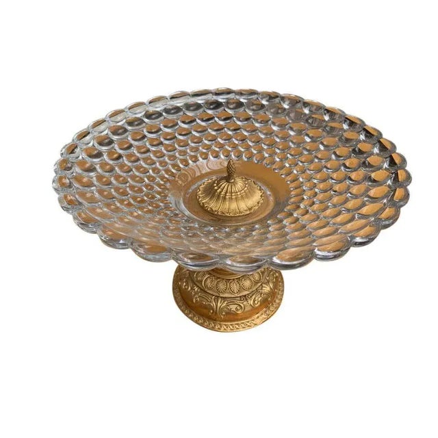 A pair of gorgeous bubble glass tazze, with gold gilded bases, 20th century. A tazza (italian, "cup", plural tazze) is a...
