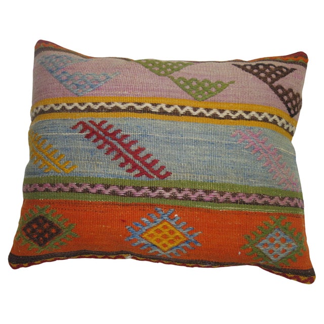 Pillow made from a vintage Turkish Kilim with cotton back. Zipper closure and foam insert provided. Measures: 16'' x 20''.