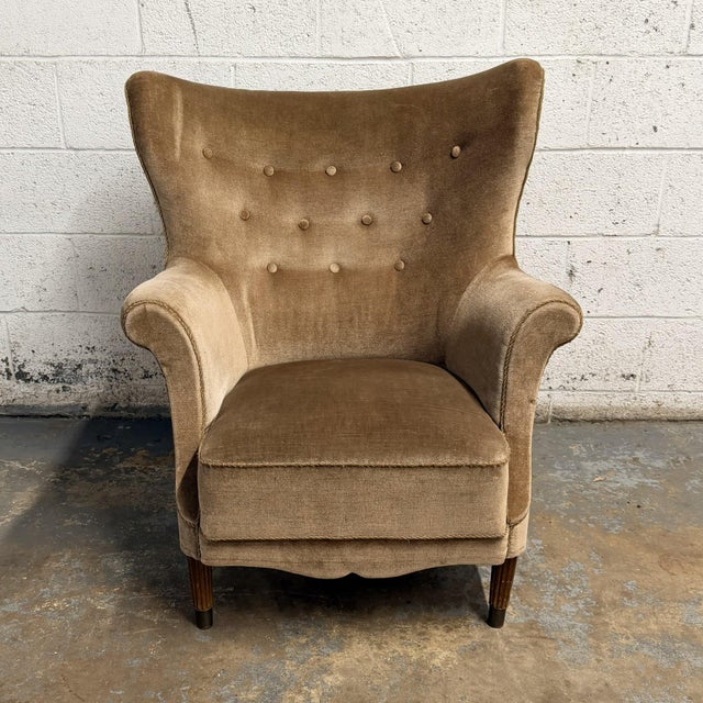 A beautiful Danish modern wingback lounge chair with a great early mid-century look, very much in the manner of Fritz...
