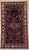 Antique hand-knotted rug from the Nahavand region of western Iran, featuring a central geometric medallion on a deep navy...