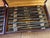 A dinner service that tells a story. twenty-four french knives from the 1930s, presented in their two original cases made...