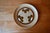 These nine stoneware dinner plates, signed Sarreguemines, evoke the 1970s taste for warm and authentic tableware. The...