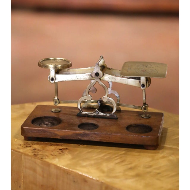 A charming survival from the golden age of handwritten correspondence, this antique postal scale was designed for weighing...
