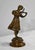 Bronze subject, with golden patina, representing a violinist in full recital. The young woman is dressed in a long dress,...