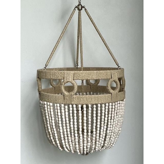 The "Frankie Malibu" chandelier by Ro-Sham-Beaux is a masterclass in coastal elegance and artisanal craftsmanship. This...
