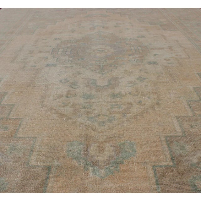Faded Turkish Hand Knotted Oushak With Medallion With Muted Colors of Tan, Muted Light Peach For Sale - Image 9 of 13