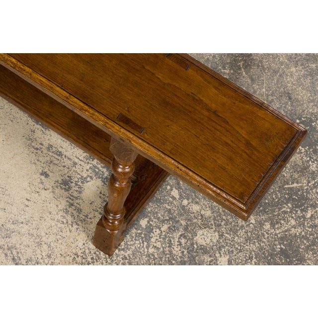 Sourced in Provence, France, this pair of late 19th French provincial oak benches reflects traditional rural...