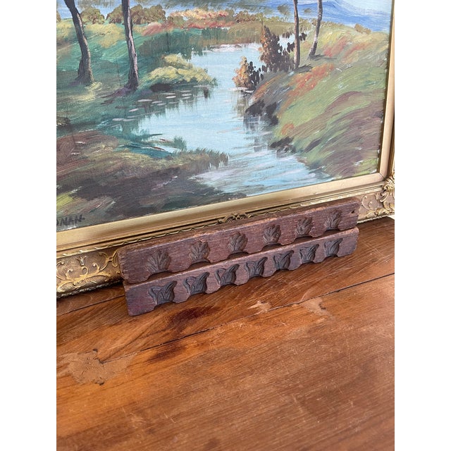This set of two antique hand-carved wood molding samples features repeating botanical motifs and was likely used as...