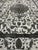 This distressed vintage Persian Tabriz rug is hand-knotted in Iran around 1940's.This vintage Persian Tabriz rug is...
