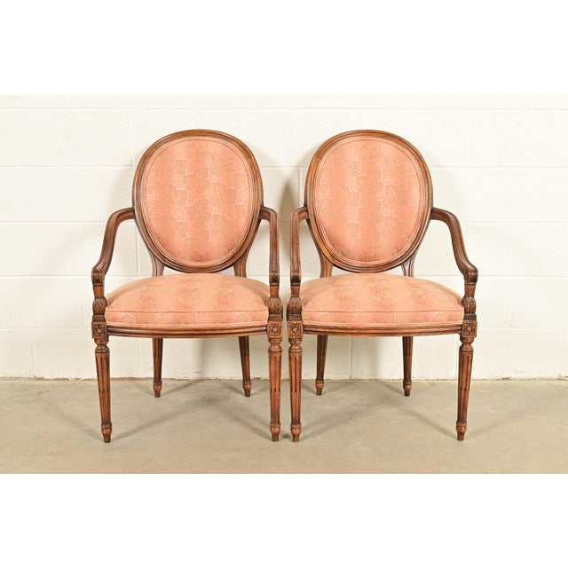 A gorgeous pair of French Regency Louis XVI style armchairs or dining captain chairs By Karges Furniture USA, Circa 1960s...
