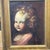 Antique oil painting on canvas depicting the face of an angel - putto from the 17th century with an antique gilded frame...