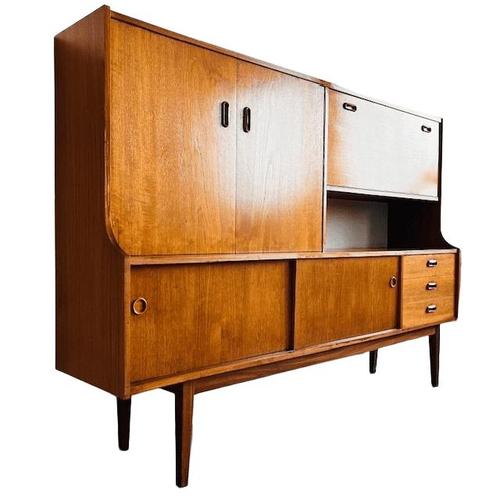 What a beauty—this mid-century Danish design highboard cabinet from the 1960s. This Scandinavian sideboard features ample...