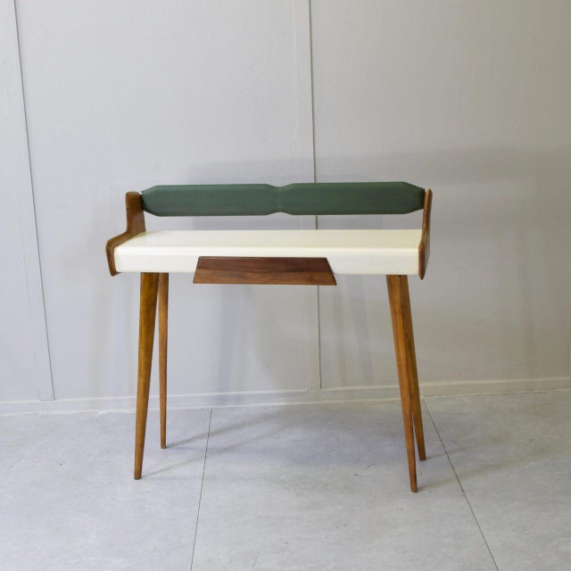 Refined entryway console table made in Italy in the 1950s in the style of Carlo De Carli. This piece is a splendid example...