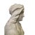 Bust depicting a female figure in white Carrara marble. Dimensions (wxdxh) 51 x 31 x 84 cm