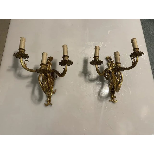 Brass vintage sconces set of 2 1960’s height 36 cm width 30 cm depth 18 cm features 3 lights new wiring installed...