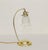Art Deco floor lamp Brass table lamp, circa 1920. Heavy, round base, curved arm. Clear glass shade, adjustable and...