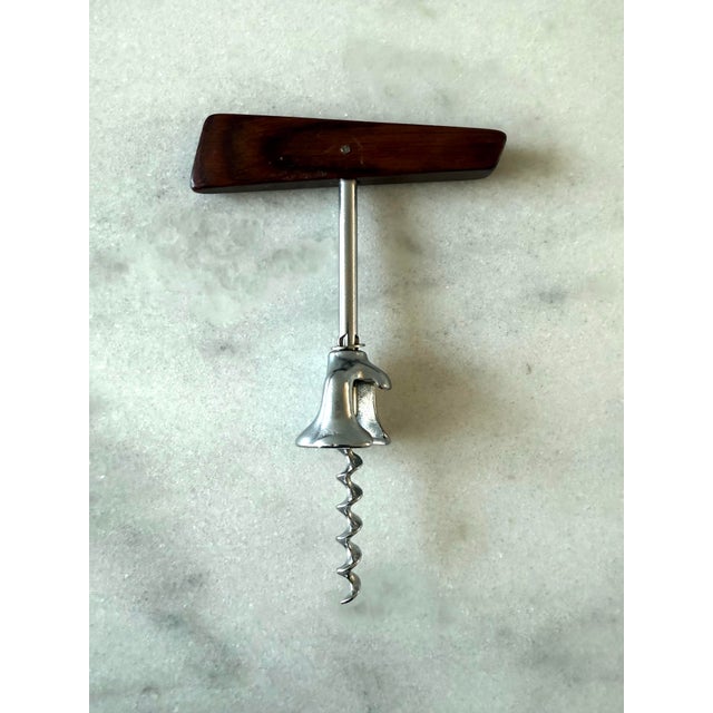 Vintage mid century rosewood corkscrew wine bottle opener with a simple shape and beautiful grain on the handle.