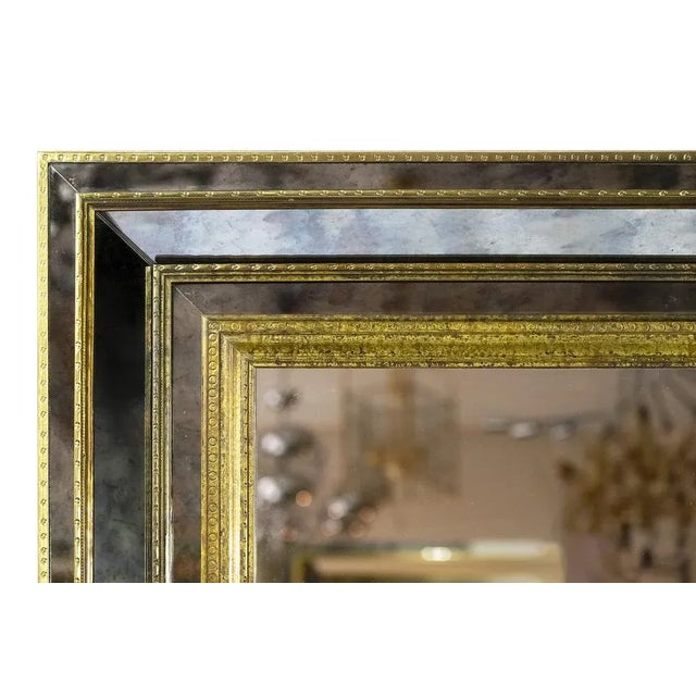 Vintage French brass on wood wall mirror. The frame is mounted with aged brass and decorated with aged mirror. Heavy and...