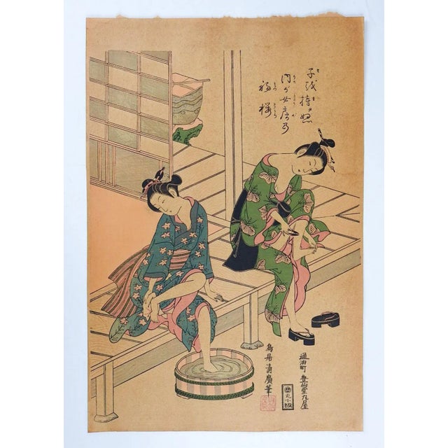 Vintage mid 20th century Japanese woodblock reprint of a beautiful courtesan by Torii Kiyohiro. Two geisha getting a...