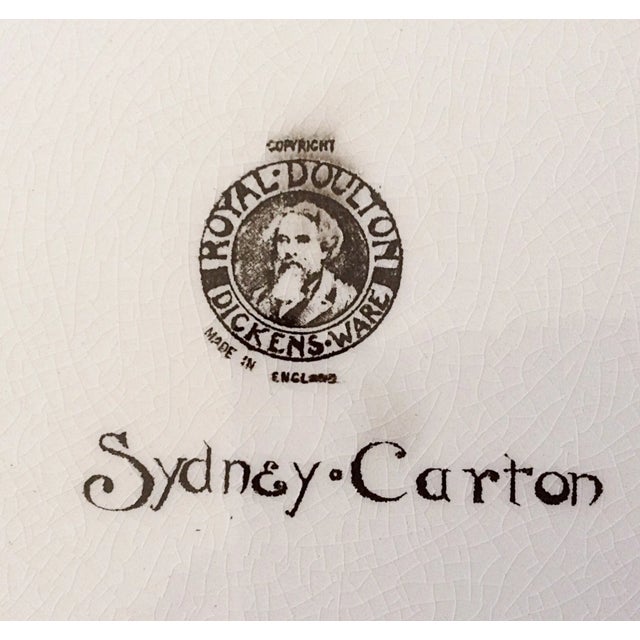 Lovely Dickens Ware plate by the English firm, Royal Doulton, portrays Sydney Carton climbing the steps to the guillotine...