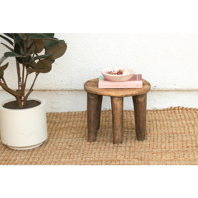 A unique piece of African art, this vintage Nupe table from Nigeria is a must-have for collectors and enthusiasts of Nupe...