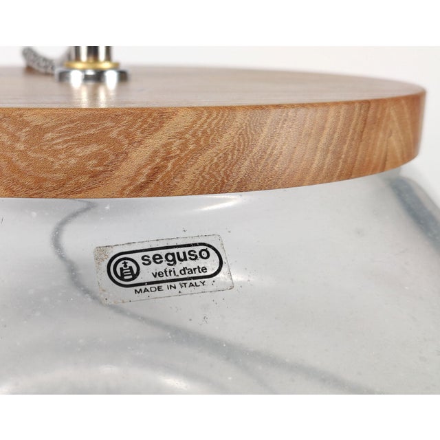 A very wide and very substantial table lamp of thick-walled mouthblown glass, in a roughly mushroom shape, decorated ‘a...