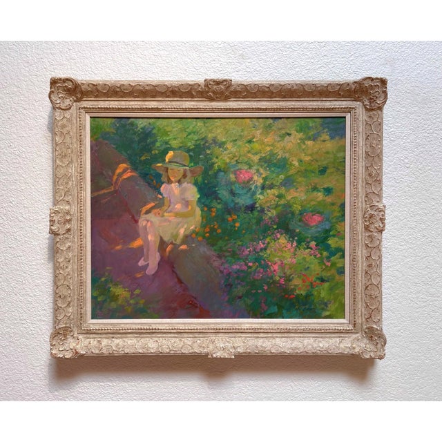 The painting depicts a young girl seated amidst a vibrant garden, surrounded by an array of colorful blooms that create a...