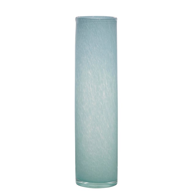 This art glass collection includes three smooth cylinder vases in subdued colors that distinguish them from the typical...
