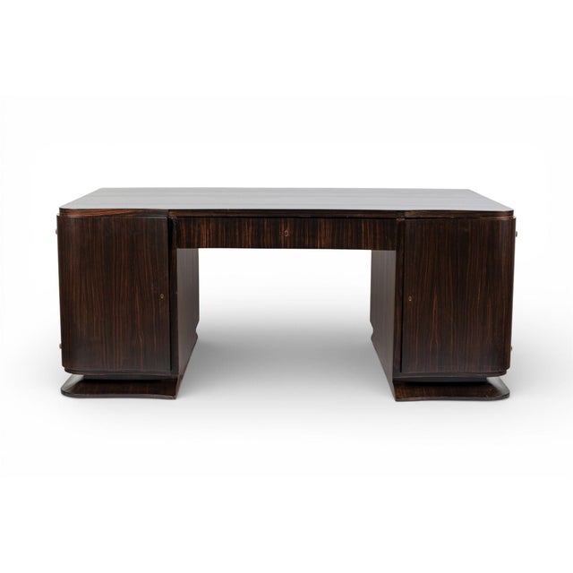 This exceptional antique Art Deco Macassar ebony wood large executive desk circa 1930 is expertly handcrafted from solid...