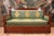 Elegant Empire period sofa, early 19th century, with a solid wood frame. It features a straight backrest framed by flat...