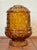 Amber 1960s Indiana Glass fairy lamp. Adds glowing ambiance to an outdoor party or relaxing on the porch. Most items found...