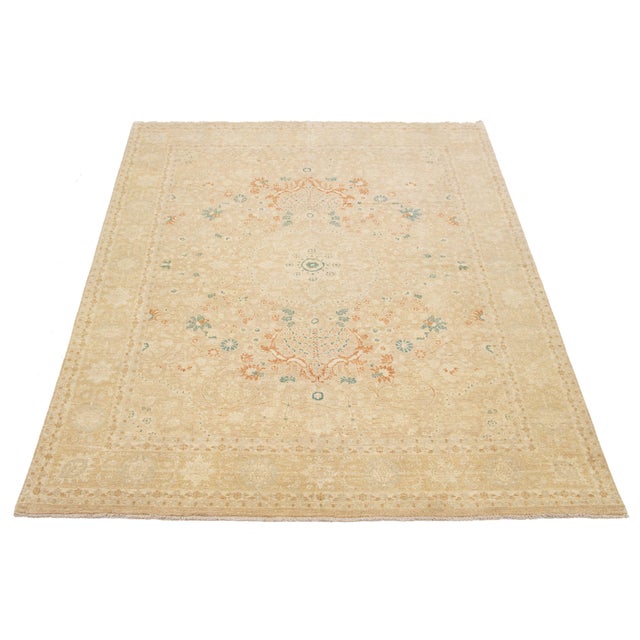 Modern Pakistani Kafkaz Rug – Hand-knotted in wool, this elegant piece features a soft beige field with a delicate...